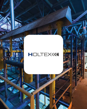 Logo HOLTEX HOLTEX logo na tle instalacji przemysłowej